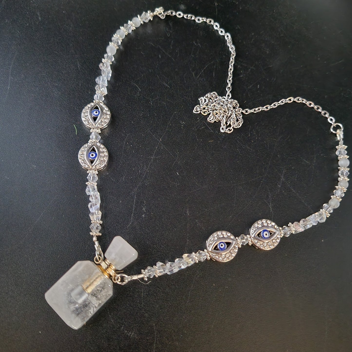 Clear crystal, Selenite, with the protection of the evil eye essential oil bottle necklace