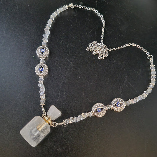 Clear crystal, Selenite, with the protection of the evil eye essential oil bottle necklace